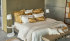 Satin bed linen "Celso de Lemos Bourdon" in 800 Miel and 101 Natural with gold embroidery