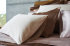 Celso de Lemos Secret" satin bed linen in 101 Naturel, 750 Amande and 500 Nuage Rose